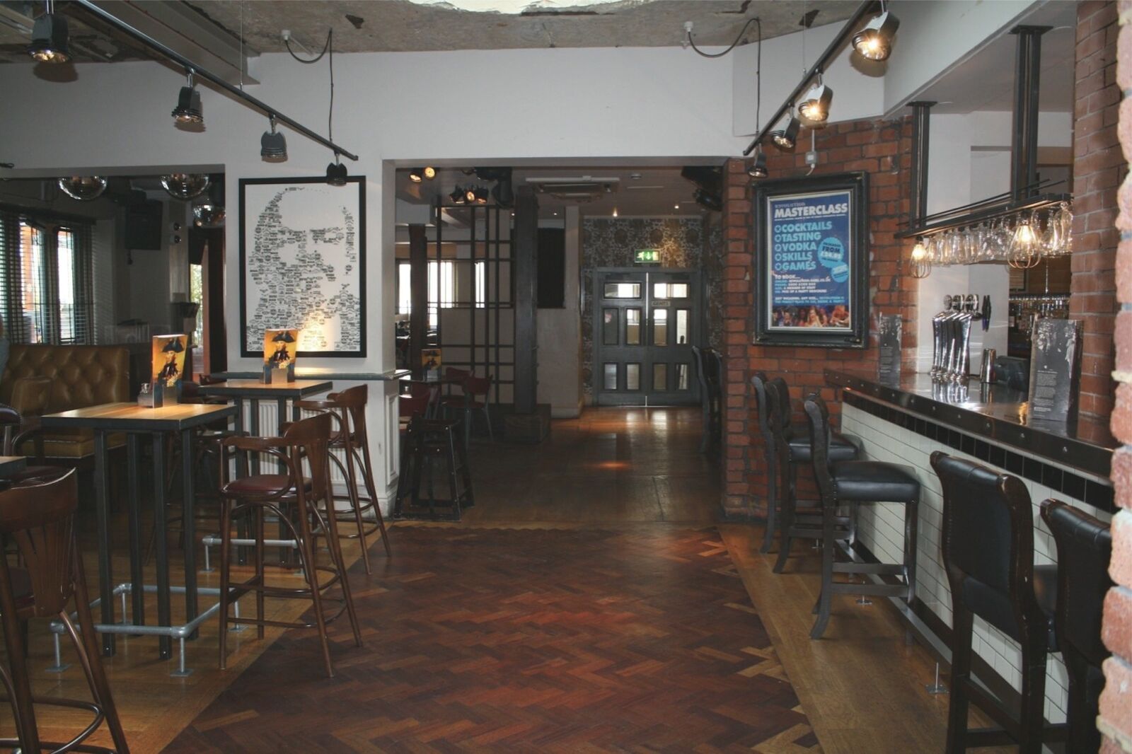 Revolution Huddersfield — bar seating and atmospheric lighting