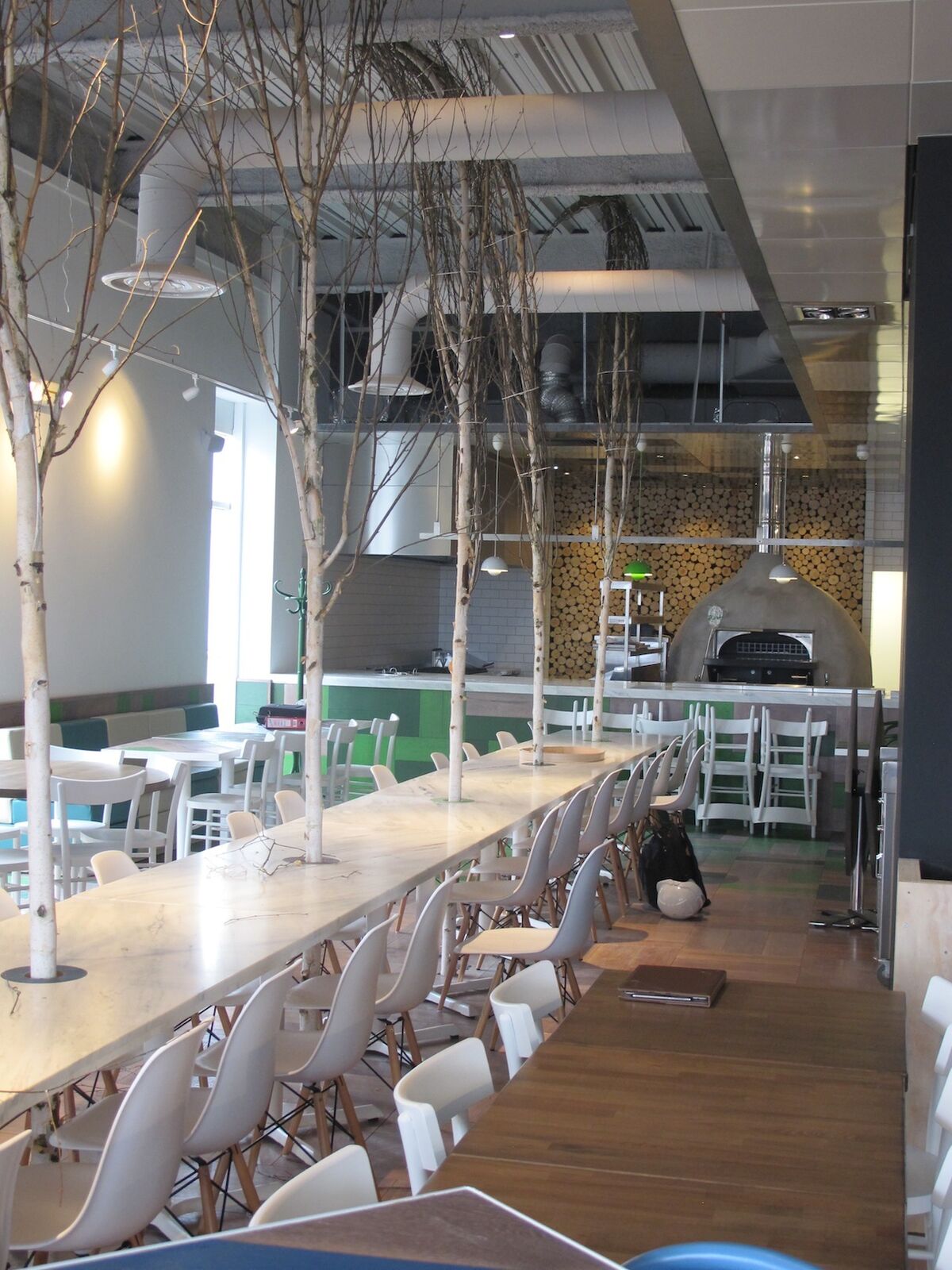 Zizzi Mermaid Quay Cardiff waterfront restaurant fit-out — dining interior overlooking the bay