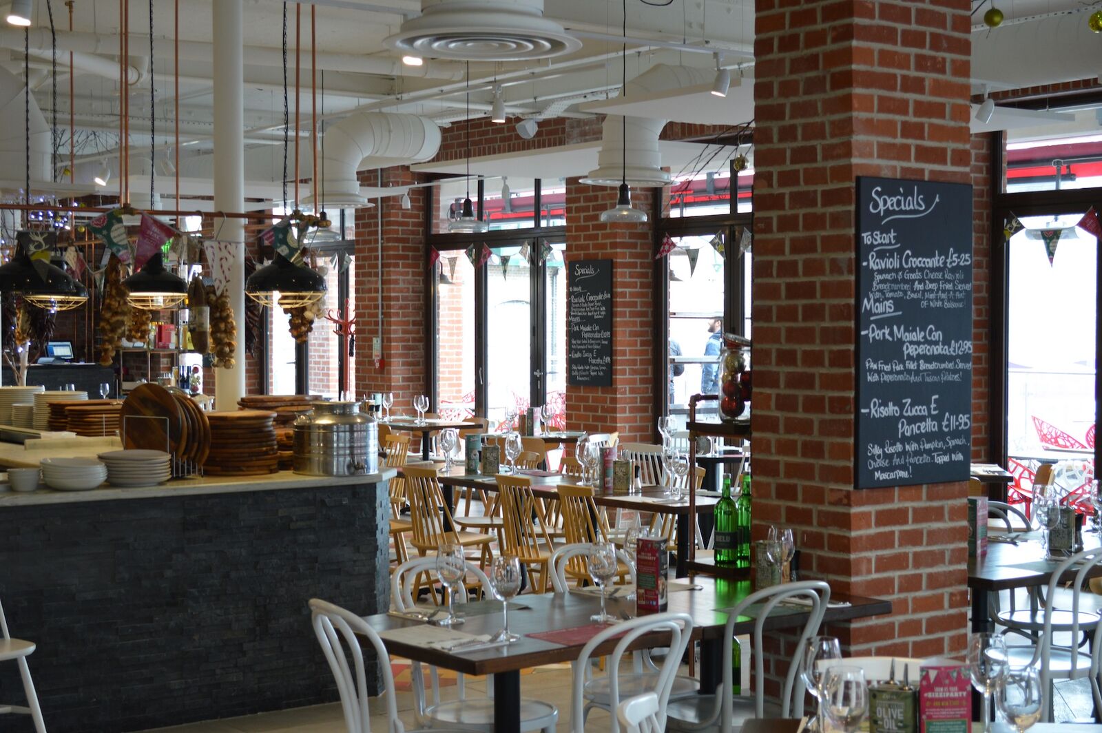Zizzi Dorchester — bespoke booth joinery and wall finishes