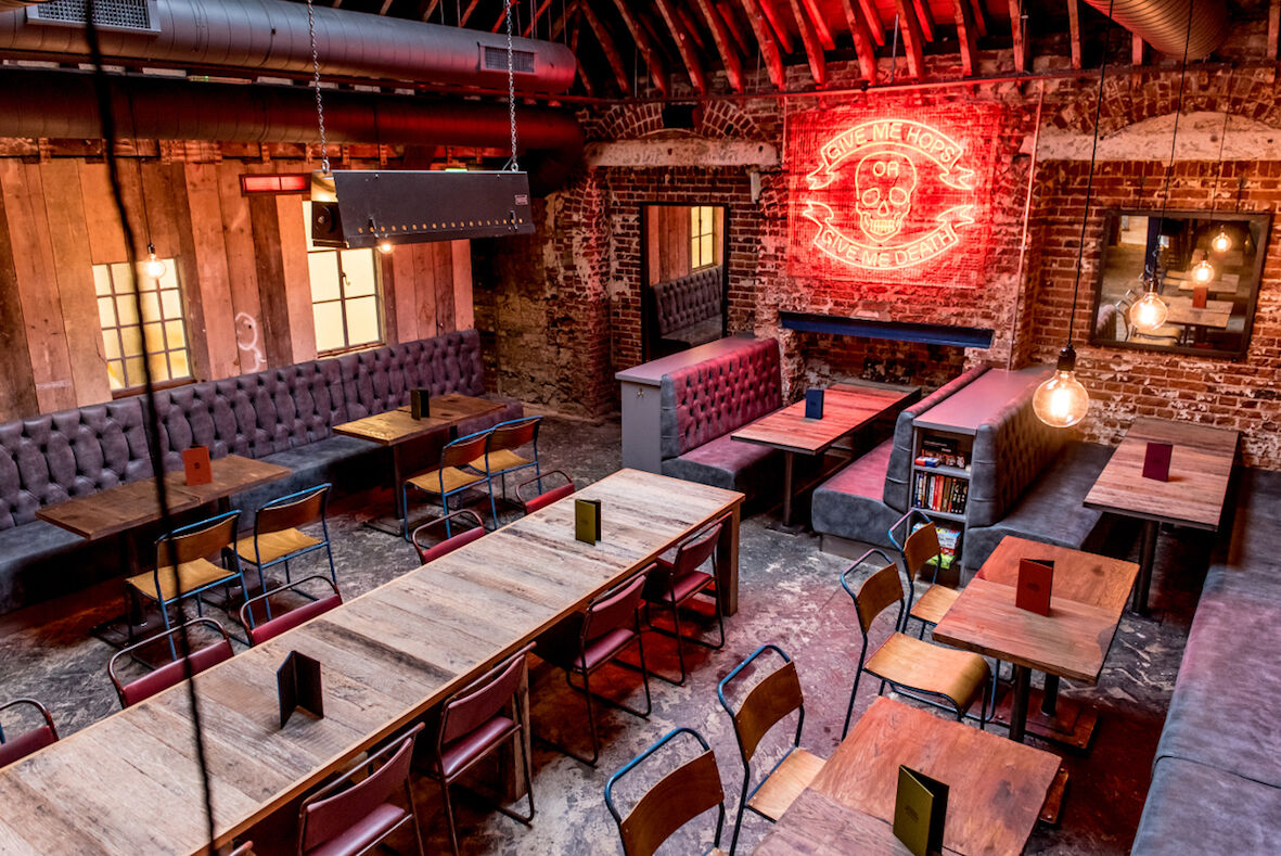 BrewDog Norwich — bar seating area and industrial-style interior finishes