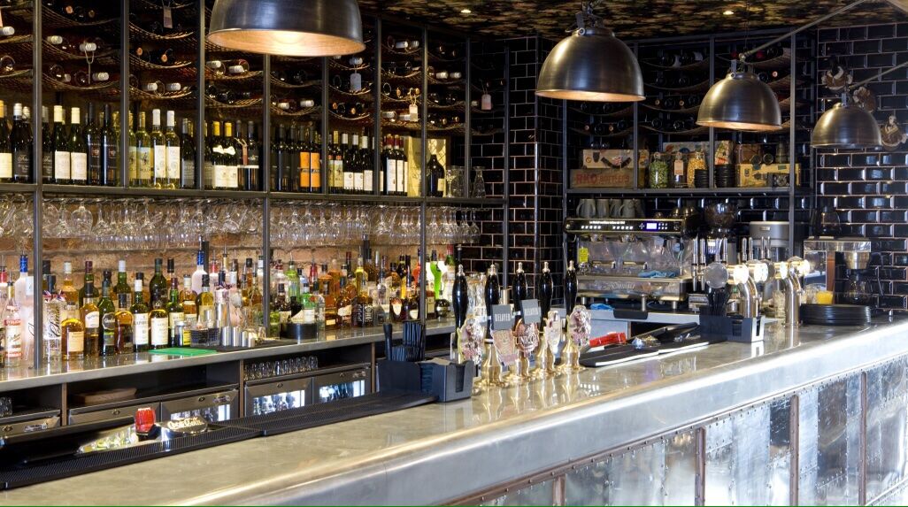 The Airport Manchester — back-bar and spirit display with custom cabinetry
