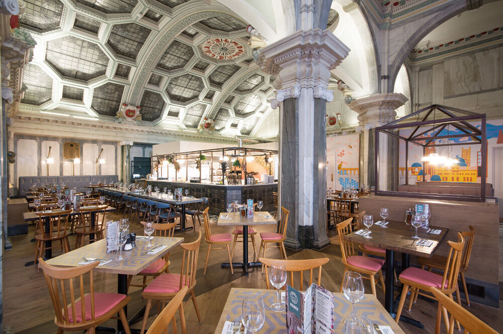 Zizzi King Street Manchester — feature bar and back-bar with decorative lighting